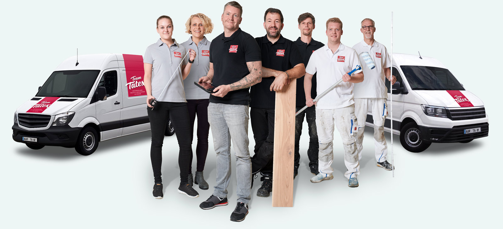 Das Handwerker-Team von Team Tatex mit den eigenen Firmenfahrzeugen
